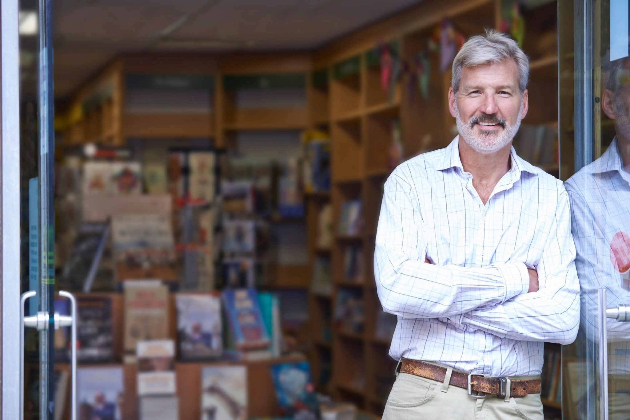 Confident businessman at storefront