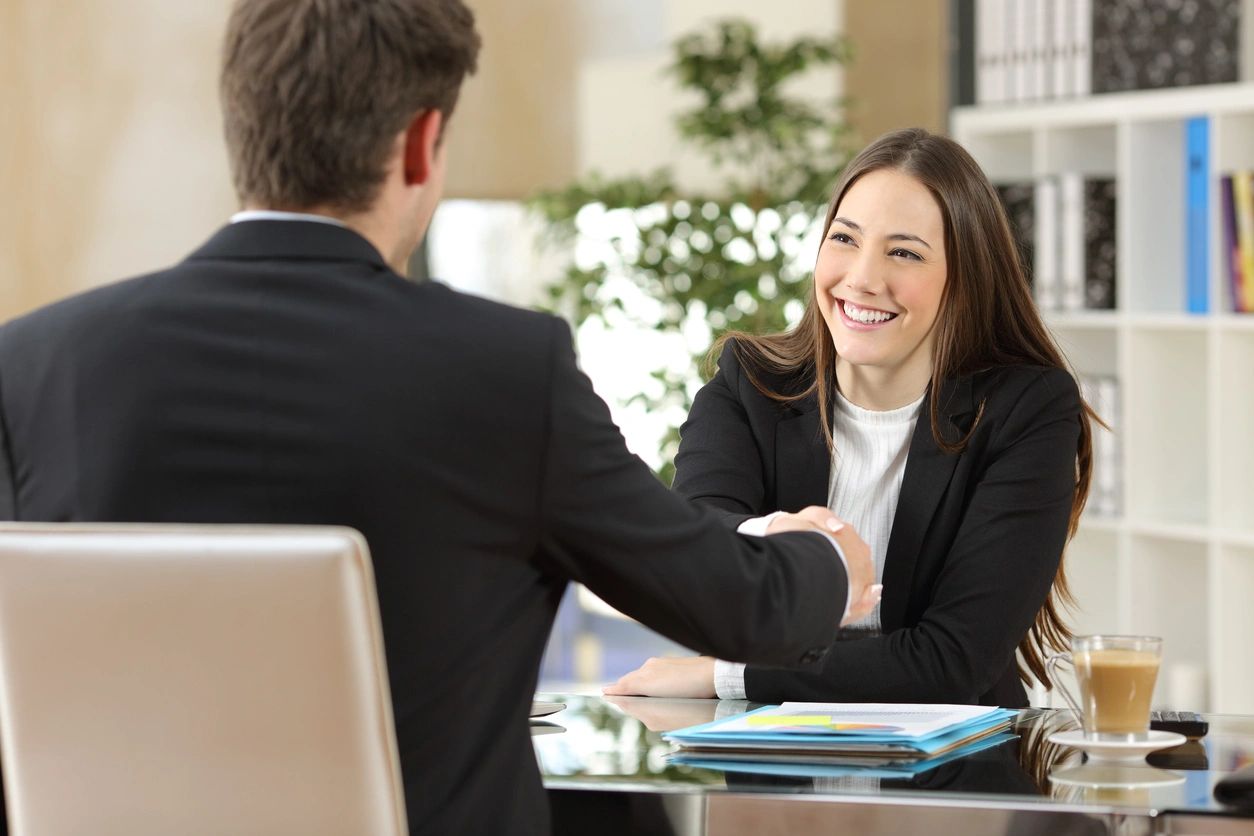 Professional woman consultant smiling with client
